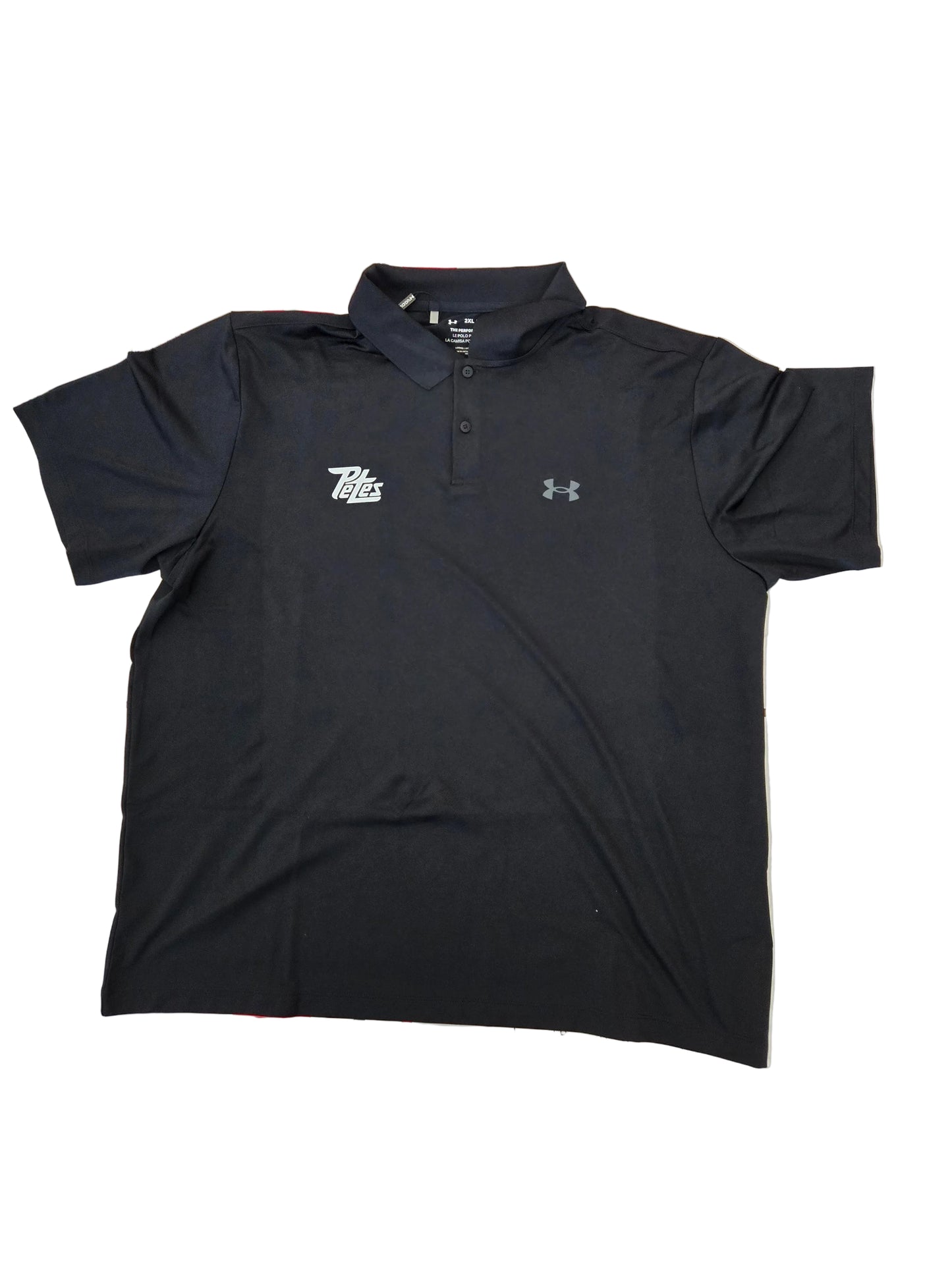 Black polo shirt on a tiled floor with visible branding