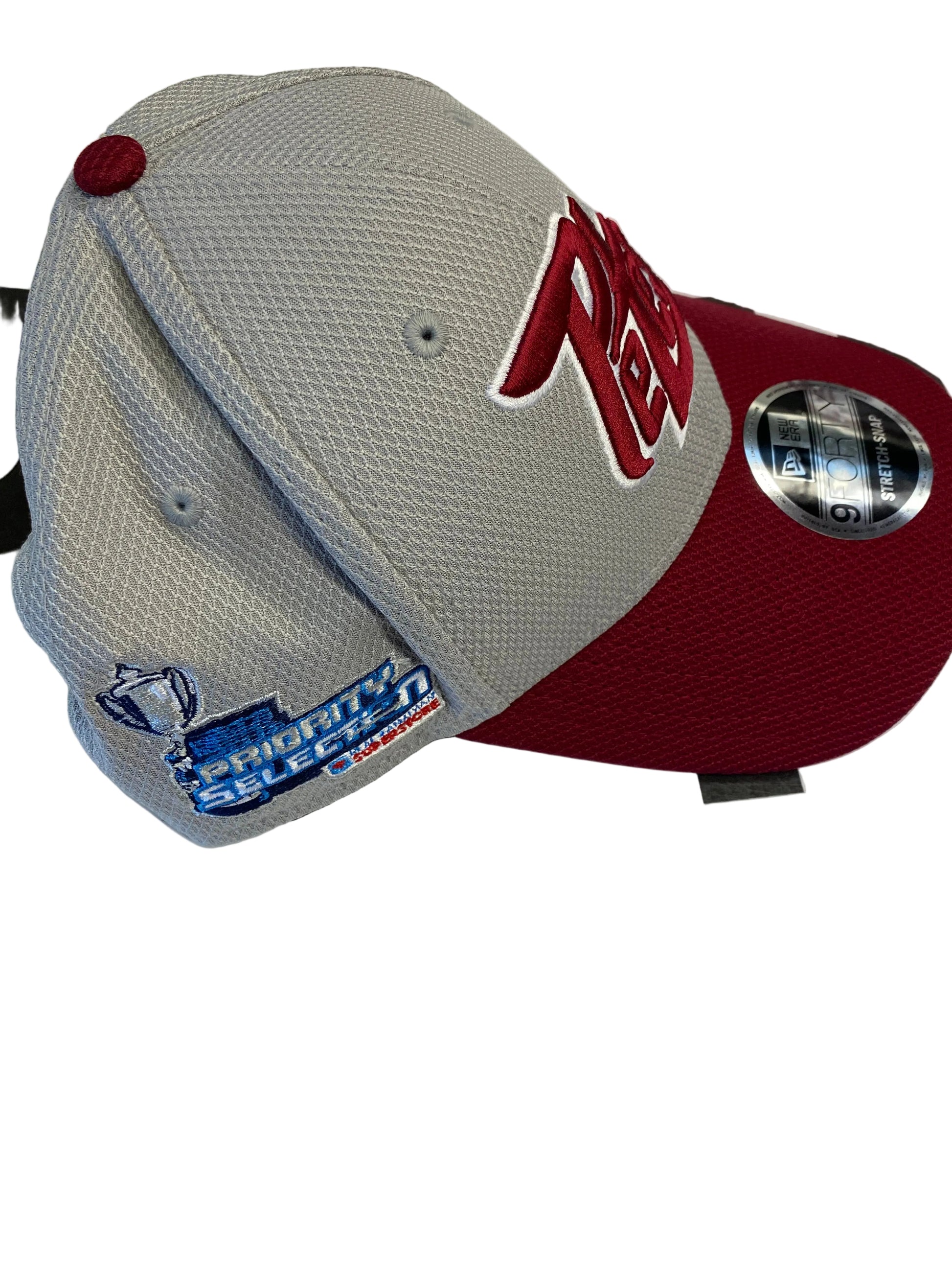 Gray and maroon baseball cap with branding on a white background