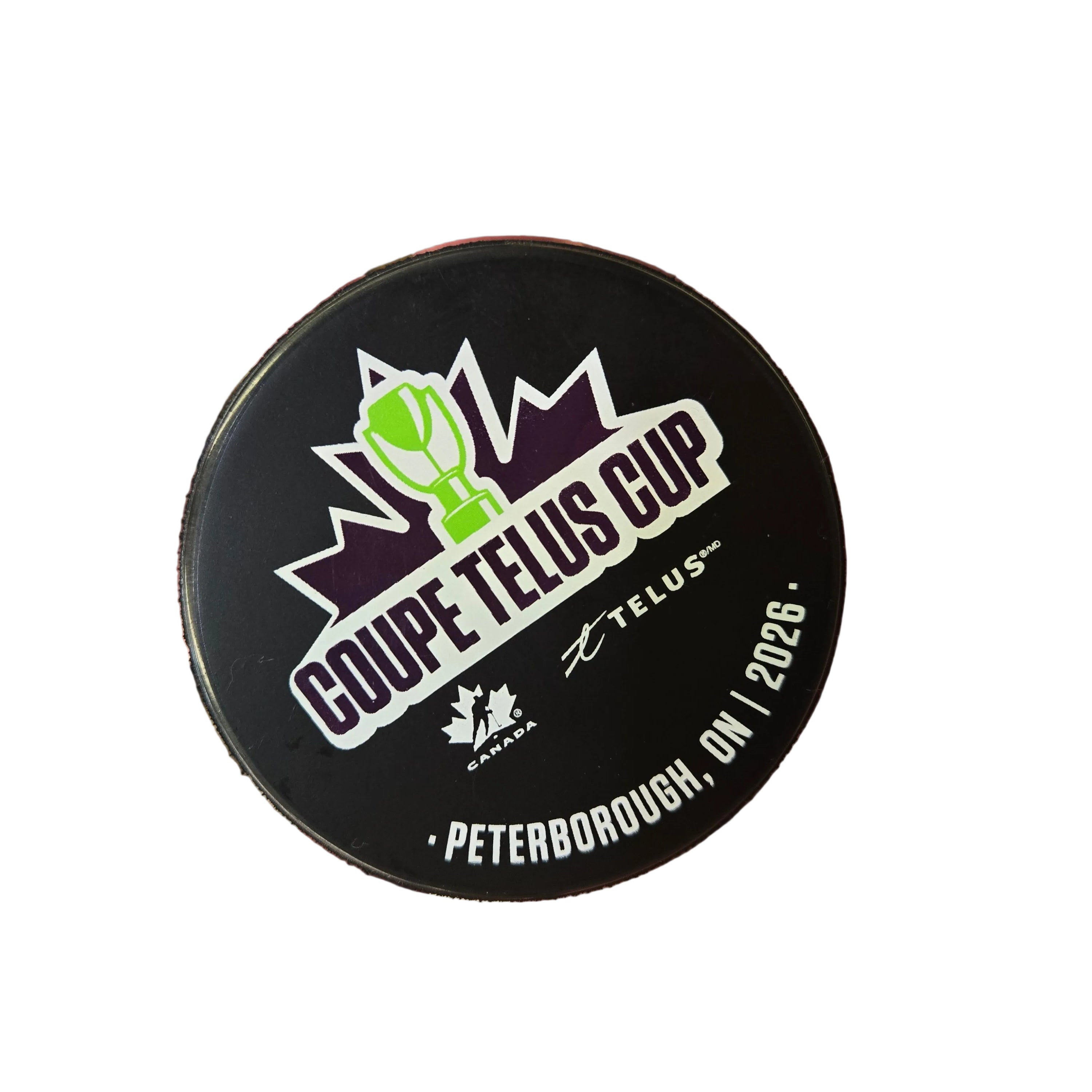 Hockey puck with Coupe Telus Cup branding on a white background