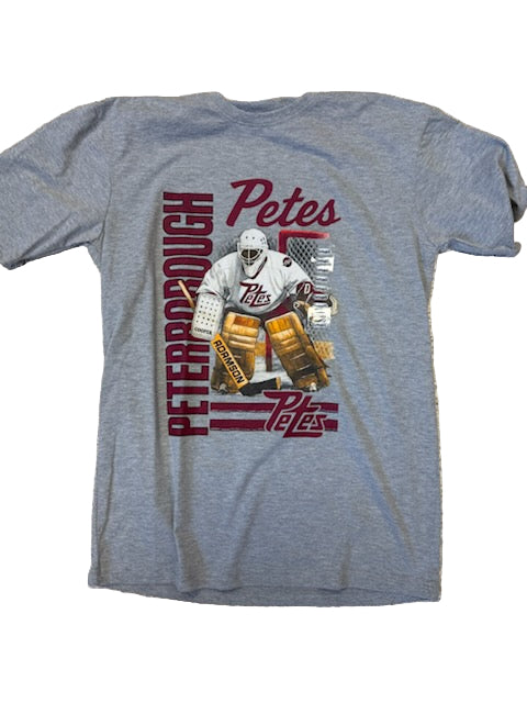 Gray t-shirt with hockey player graphic and 'Peterborough Petes' text on a textured surface