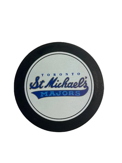 Hockey puck with 'Toronto St. Michael's Majors' text on a white background