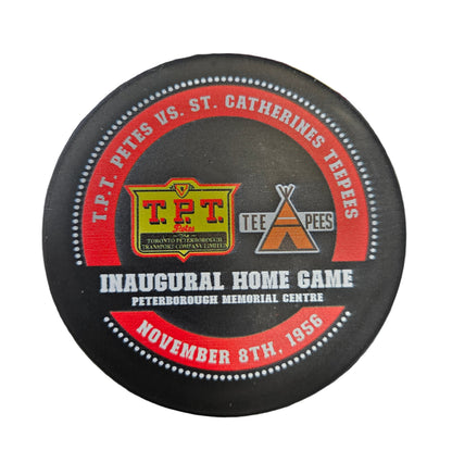 Hockey puck commemorating the inaugural home game between T.P.T. Petes and St. Catharines Teepees on November 8th, 1956.